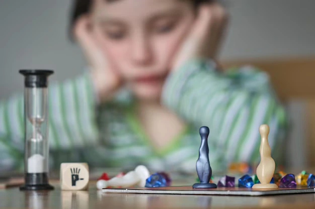 Child showing lack of focus and attention during activity indicating ADHD symptoms