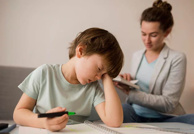Child struggling with focus and attention during learning activity indicating ADHD symptoms