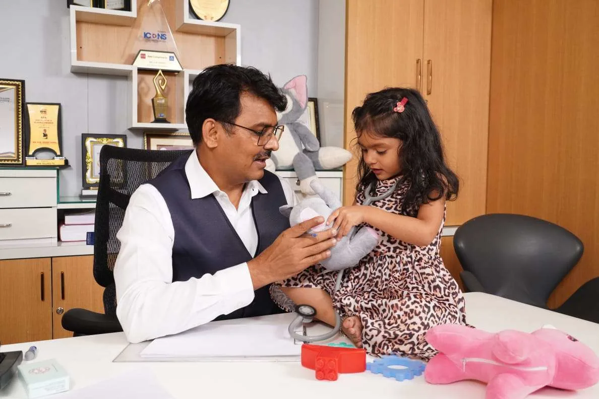 Doctor engaging a child in play therapy session to support autism and developmental skills
