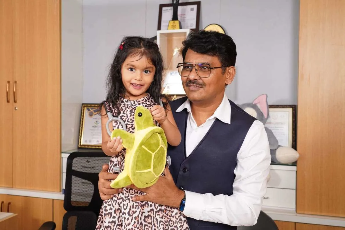Doctor interacting with a child using toys during autism therapy to support development