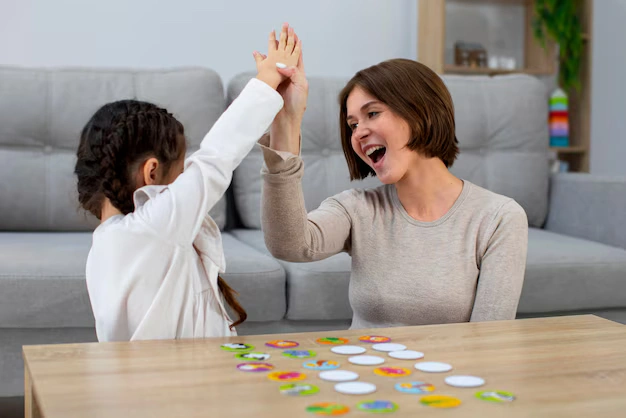 Parent encouraging child during interactive learning activity to support development and confidence