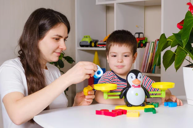 Parent engaging child in educational play activity to support learning and developmental skills